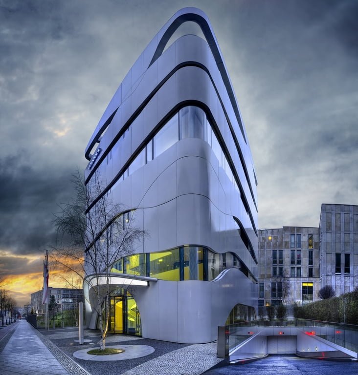 facade of modern building with geometric windows and curved walls 1